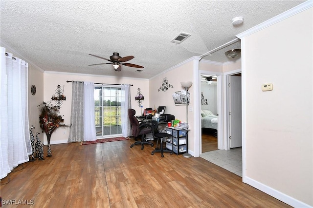 1132 W Red Rd, Labelle, FL 33935 - office featuring a ceiling fan, wood finished floors, ornamental molding, baseboards, and a textured ceiling