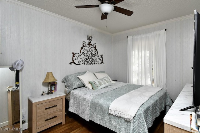 1132 W Red Rd, Labelle, FL 33935 - bedroom with ornamental molding, dark wood-style flooring, a textured ceiling, and a ceiling fan