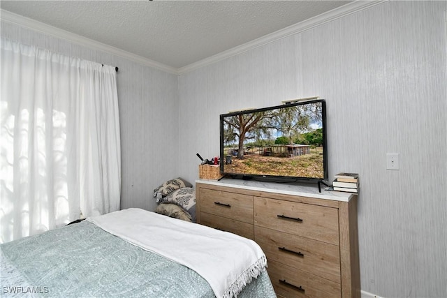 bedroom with ornamental molding and a textured ceiling