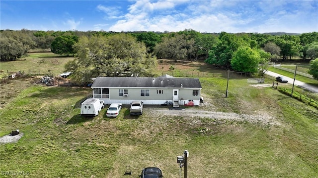 birds eye view of property with a rural view