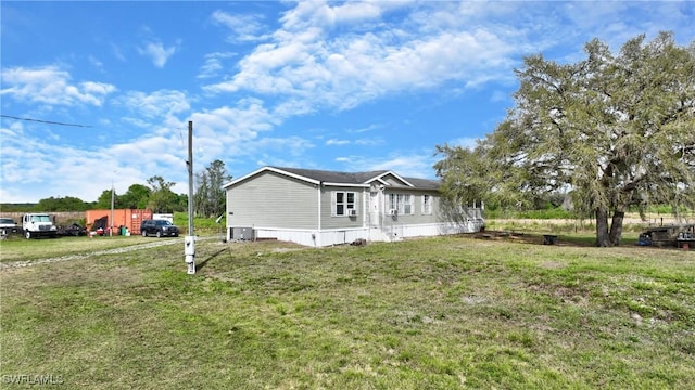 view of home's exterior featuring a lawn