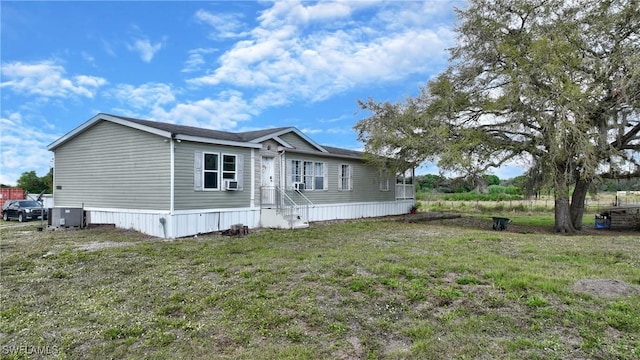 1132 W Red Rd, Labelle, FL 33935 - view of property exterior featuring cooling unit and a yard