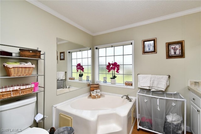 bathroom with toilet, ornamental molding, a bath, and a healthy amount of sunlight