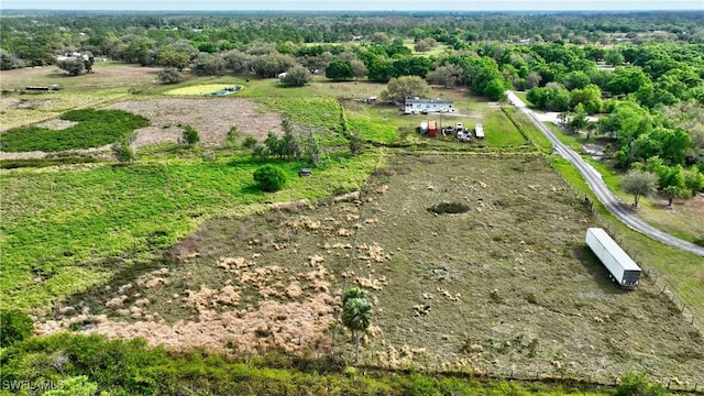 birds eye view of property featuring a rural view