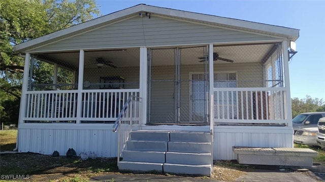 exterior space featuring a ceiling fan and covered porch