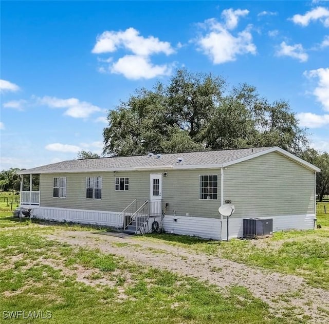 1132 W Red Rd, Labelle, FL 33935 - rear view of house with central AC