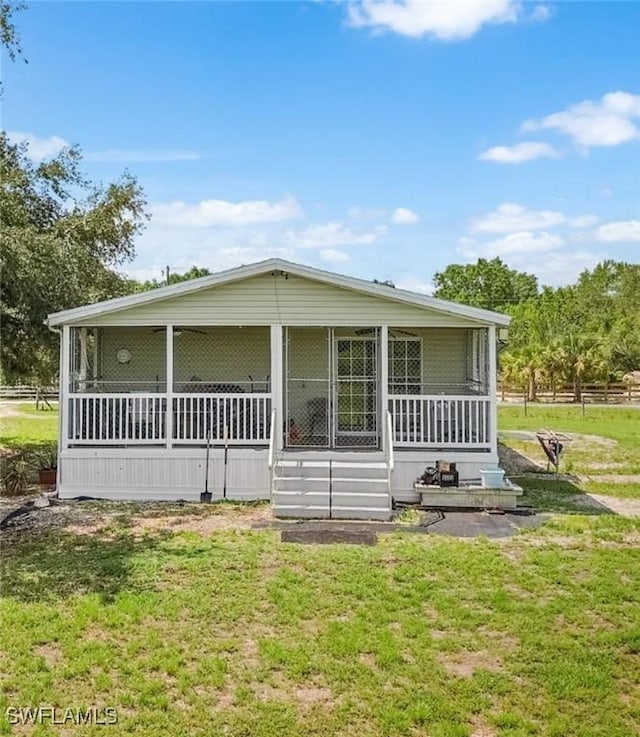 1132 W Red Rd, Labelle, FL 33935 - view of front of property with a sunroom