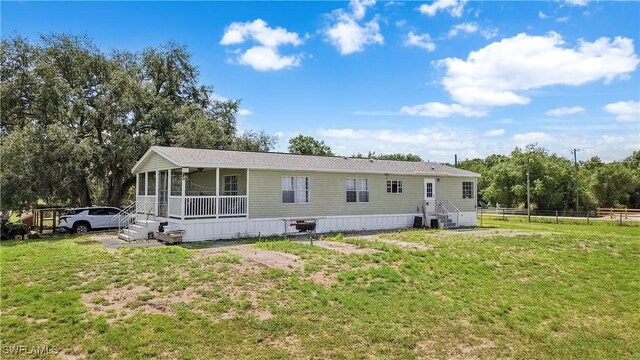 1132 W Red Rd, Labelle, FL 33935 - back of house with a sunroom