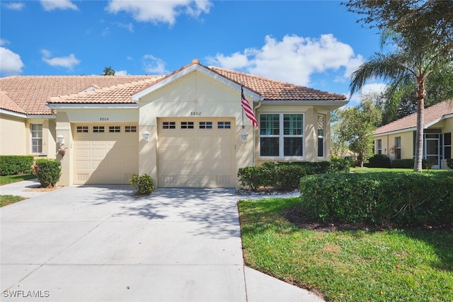 mediterranean / spanish house featuring a garage