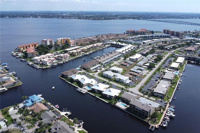 aerial view with a city view and a water view