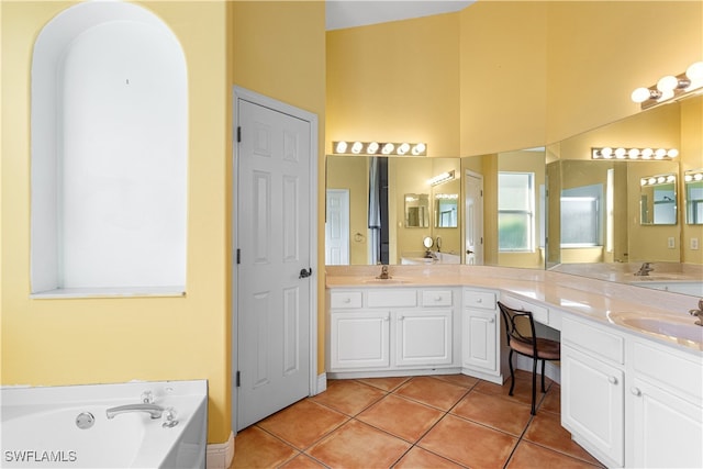 bathroom with vanity, a bathtub, and tile patterned floors