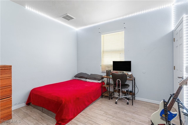 bedroom with light hardwood / wood-style floors