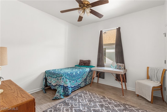 bedroom featuring ceiling fan and wood-type flooring