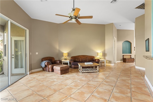 tiled living room with ceiling fan