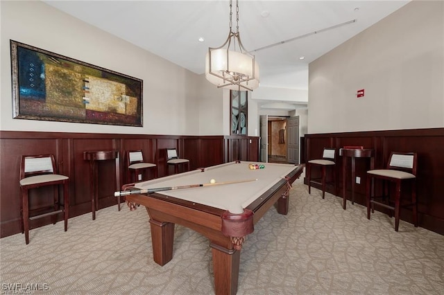 playroom with pool table, a wainscoted wall, and light carpet