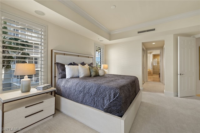 bedroom with light colored carpet, visible vents, baseboards, a raised ceiling, and crown molding