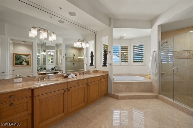 full bathroom with double vanity, a stall shower, a sink, tile patterned flooring, and a bath