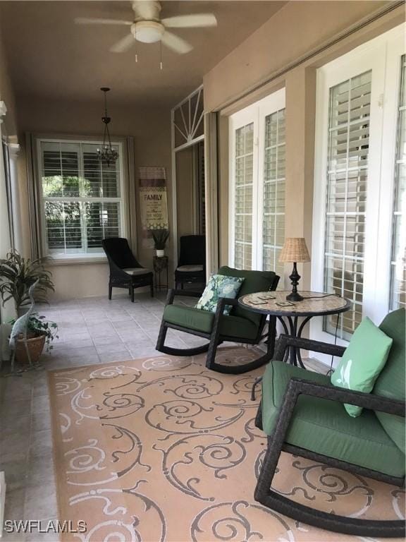 sunroom / solarium with ceiling fan