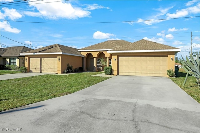 ranch-style house with a garage, a front lawn, and stucco siding