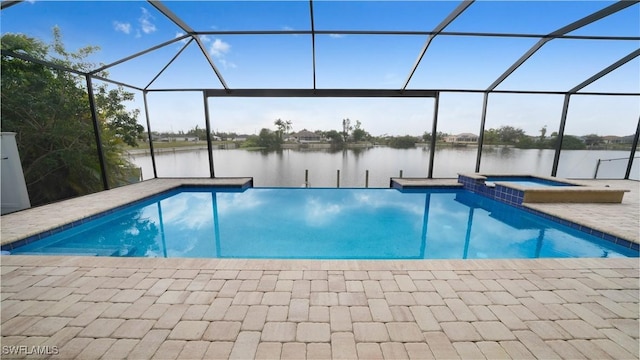 view of pool with an in ground hot tub, a water view, a lanai, and a patio area