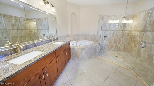 bathroom with tile patterned floors, vanity, and independent shower and bath