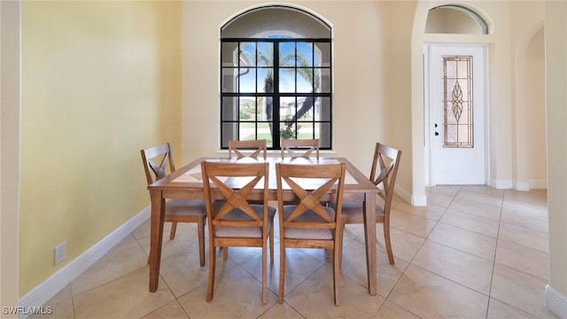 dining room with light tile patterned flooring