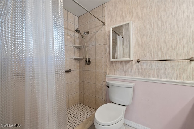 bathroom featuring walk in shower and toilet