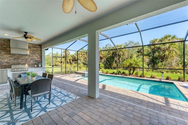 view of swimming pool with a ceiling fan, a patio, grilling area, a lanai, and exterior kitchen