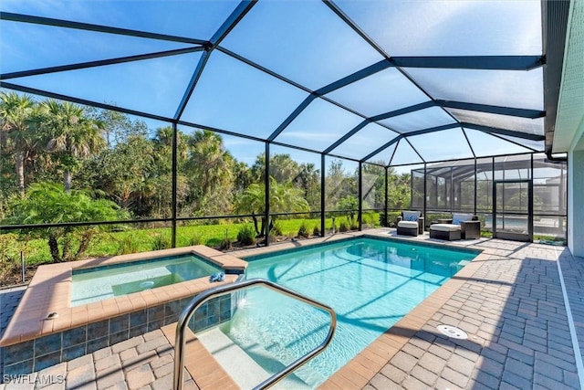 view of swimming pool with a lanai, a patio area, and a pool with connected hot tub