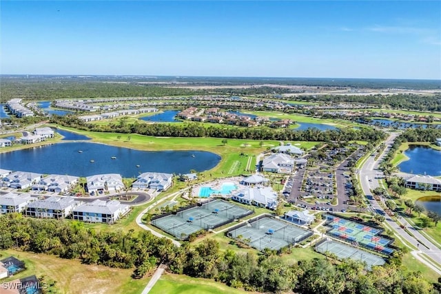 birds eye view of property featuring a water view and a residential view