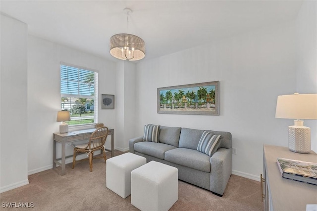 living area featuring light carpet, an inviting chandelier, and baseboards