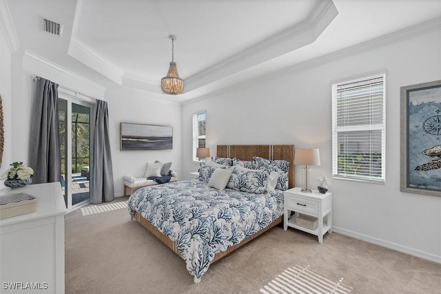 bedroom featuring access to exterior, a tray ceiling, visible vents, light colored carpet, and baseboards