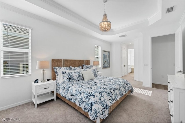 bedroom with light carpet, baseboards, visible vents, a raised ceiling, and ornamental molding