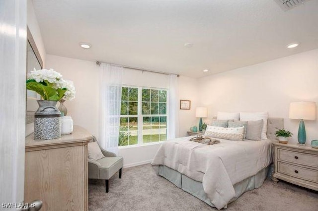 bedroom featuring light colored carpet