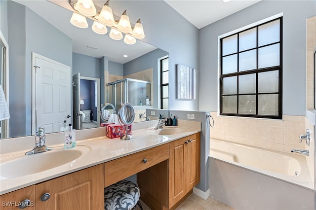 ensuite bathroom featuring ensuite bathroom, a sink, a bath, and a shower stall