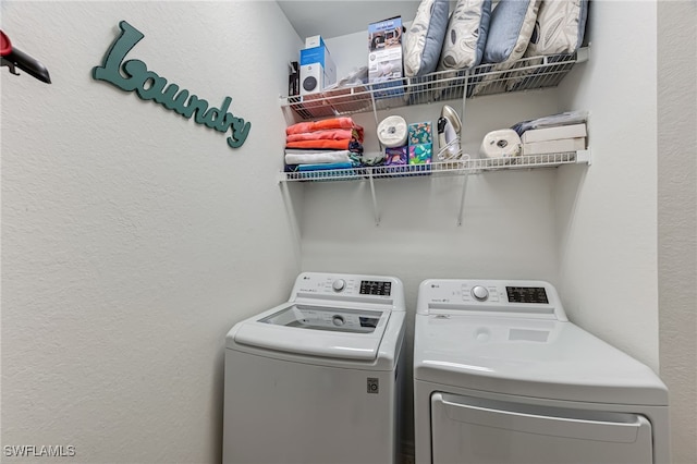 laundry area with laundry area and washer and clothes dryer