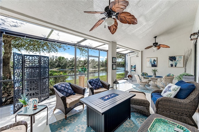 sunroom / solarium with a water view