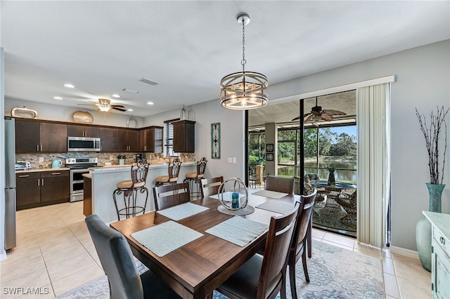 dining area featuring light tile patterned floors, visible vents, a ceiling fan, and recessed lighting