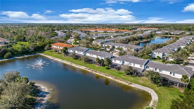 drone / aerial view with a water view and a residential view