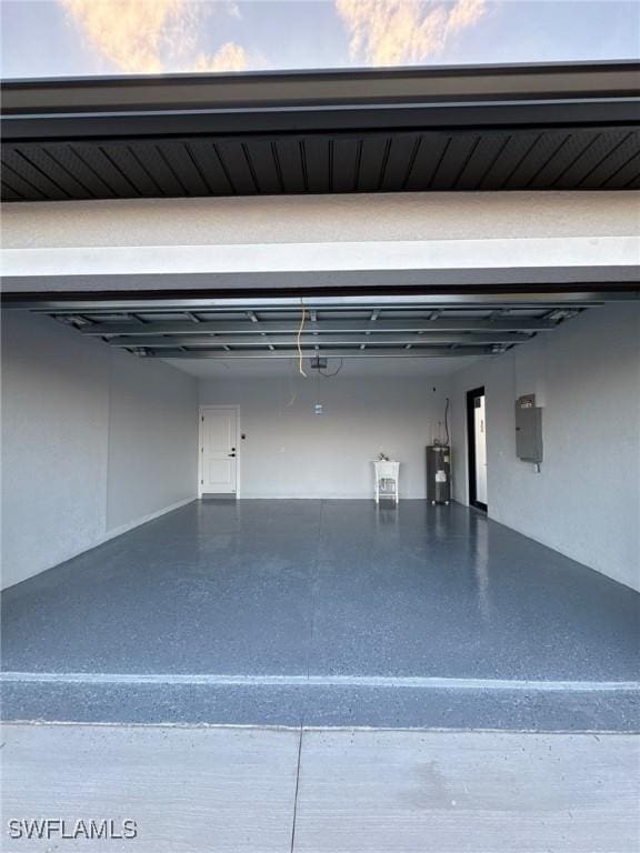 garage with electric panel and water heater