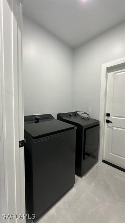 laundry room featuring laundry area and separate washer and dryer