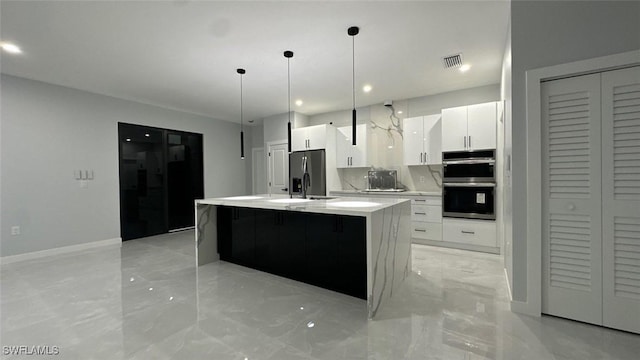 kitchen featuring appliances with stainless steel finishes, modern cabinets, visible vents, and white cabinets