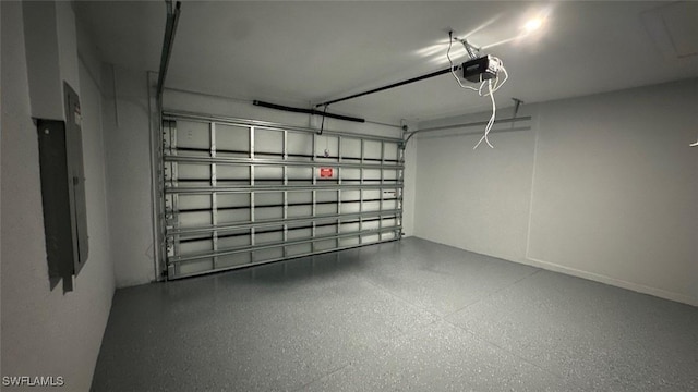 garage with electric panel and a garage door opener