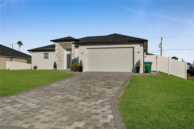 view of front facade featuring a front yard and a garage