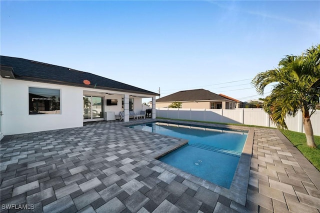 view of swimming pool with a patio