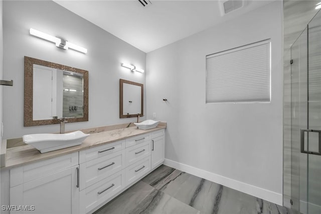 bathroom with vanity and walk in shower