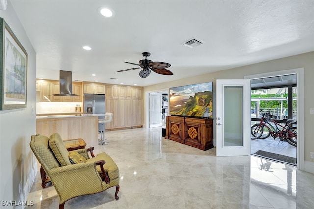 interior space with french doors and ceiling fan