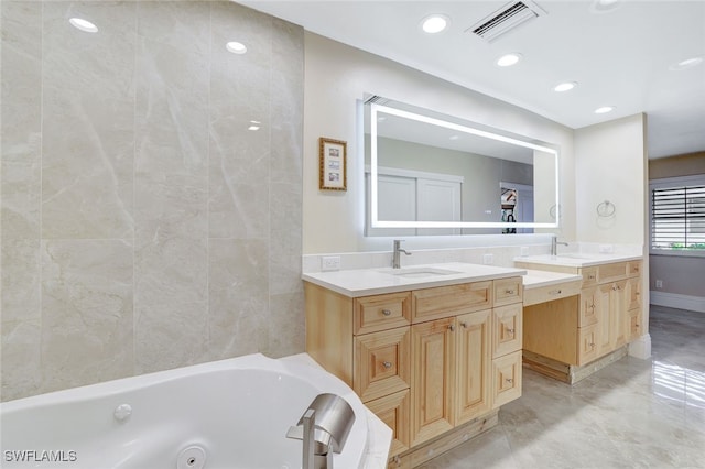 bathroom featuring vanity and a bathtub