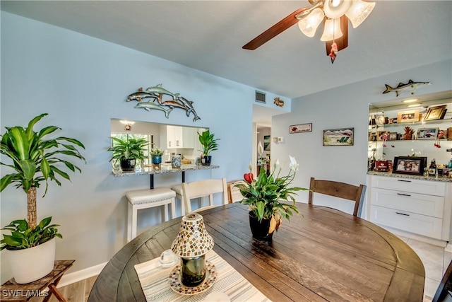 dining room with visible vents and a ceiling fan