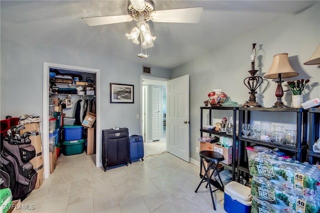 interior space with a ceiling fan and visible vents